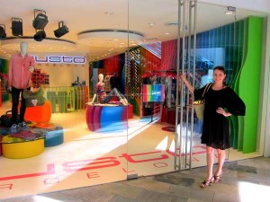 Photo of Kristen Colapinto in front of the Custo Barcelona store in Aruba.